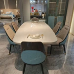 Cream White High-Gloss Dining Table with Rounded Corners and Architectural Gold Metal Bas